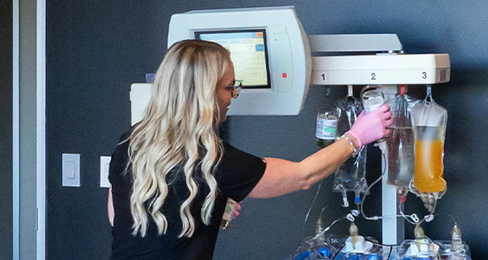 Clinician monitoring plasma exchange session at Ways2Well