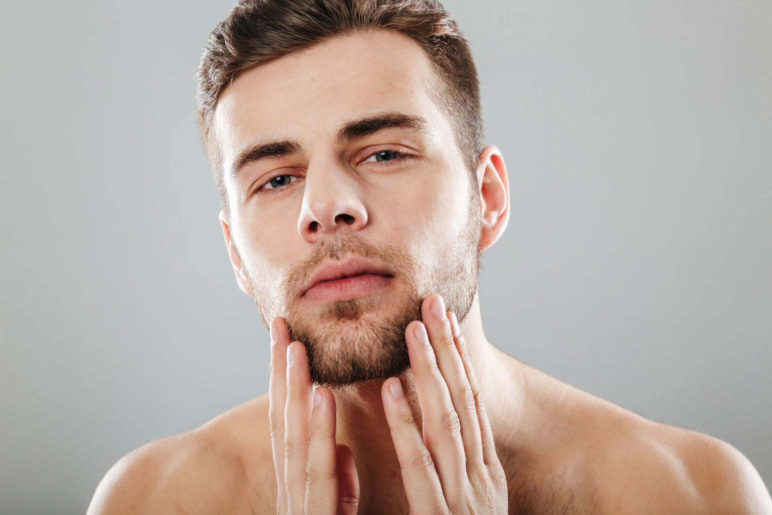 Man touching face