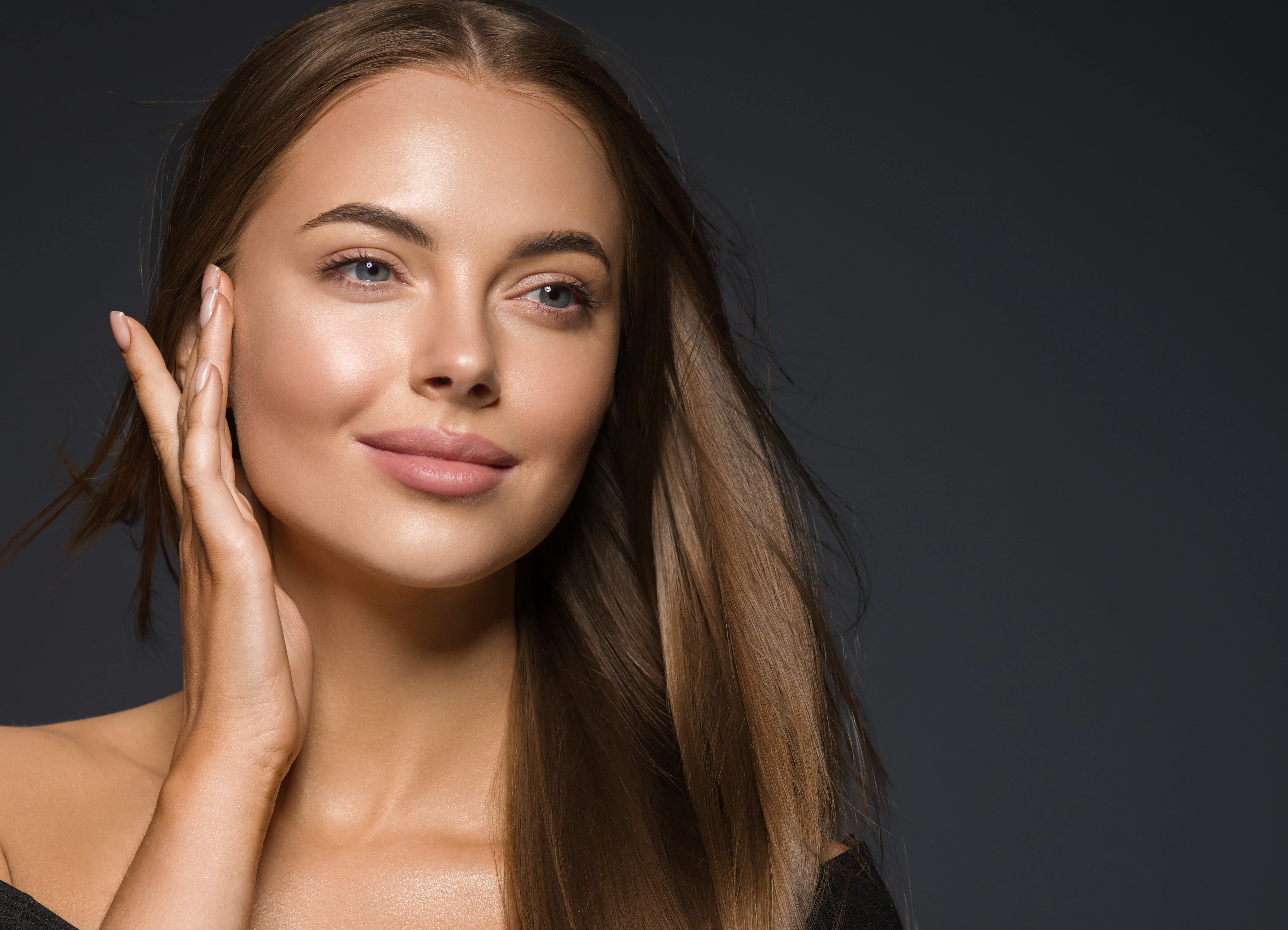 Woman treating her face skin