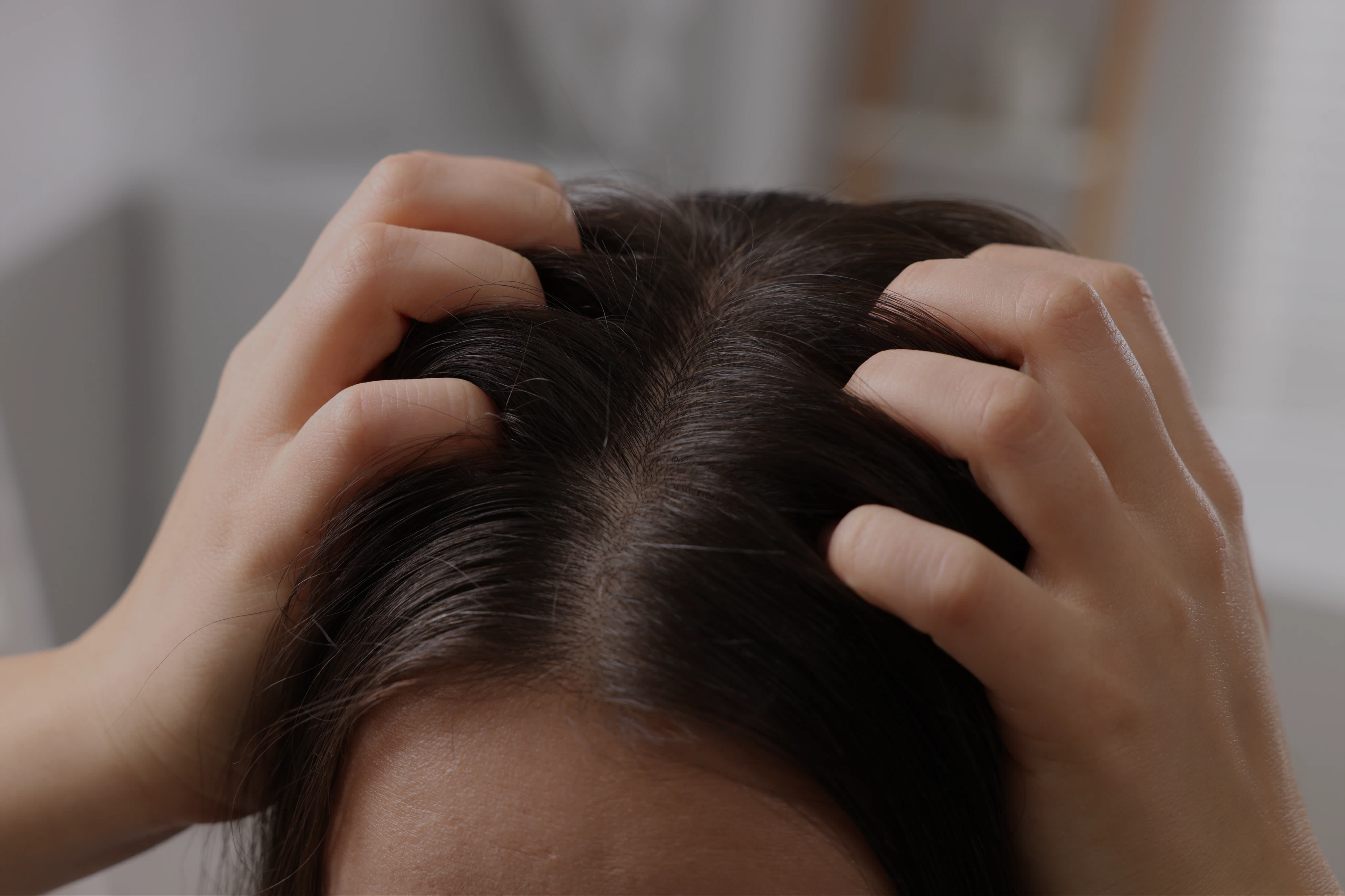 Woman touching hair